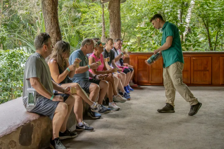 a group of people sitting on a bench