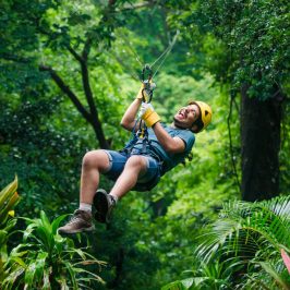 a man swinging on a zipline