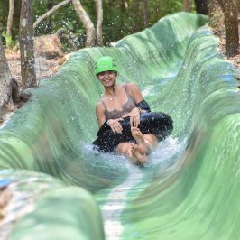 a woman tubing down a water slide