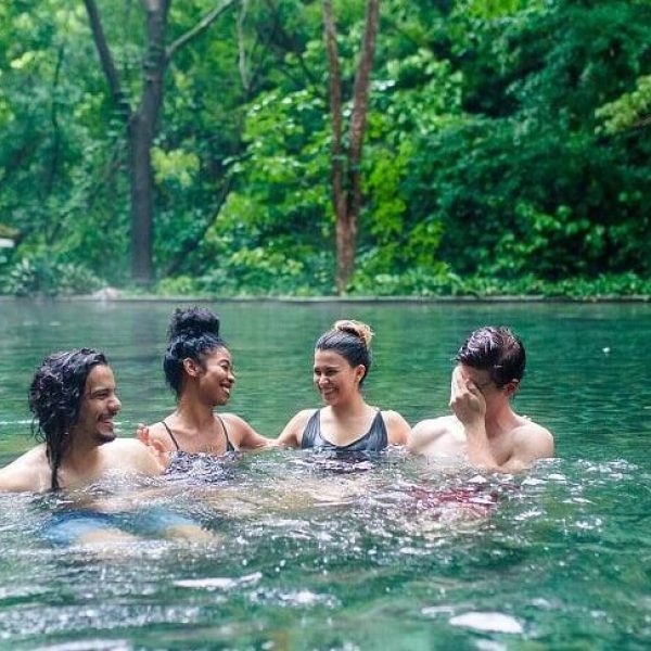 a group of people swimming in the water