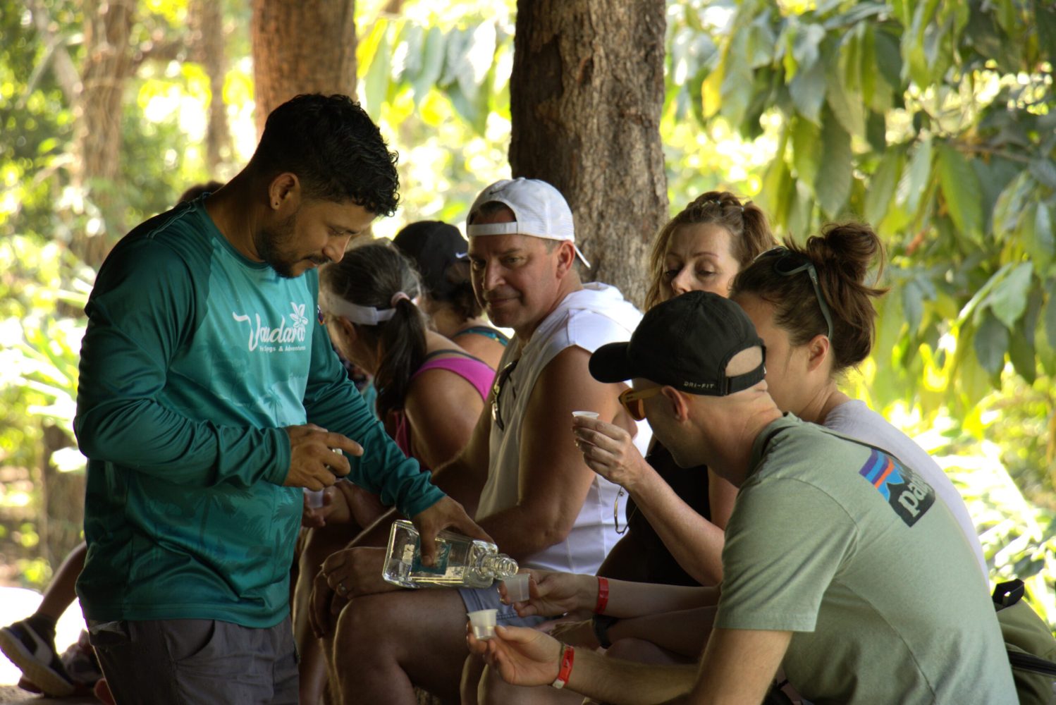 a group of people looking at a cell phone