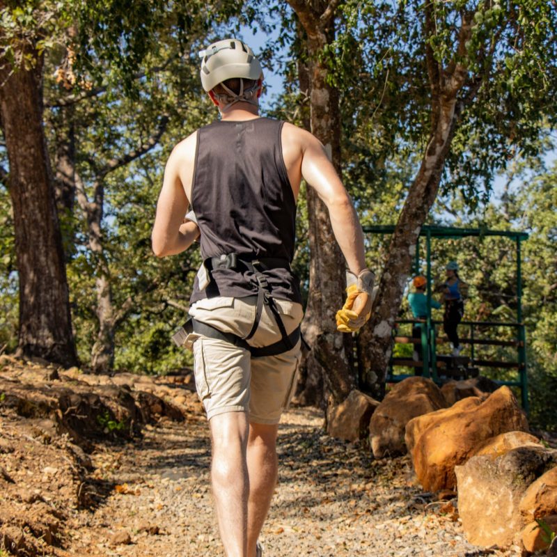 a man walking down a dirt road