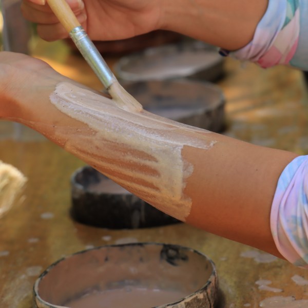 a person cutting a spoon