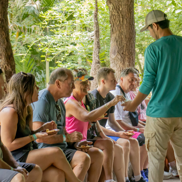 a group of people sitting on a bench