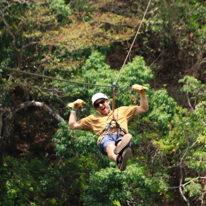 a man jumping in the forest