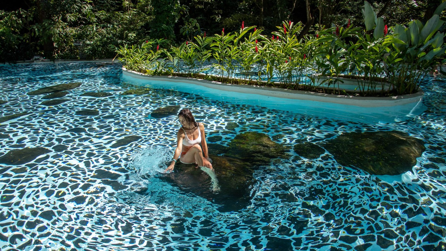 a group of people in a pool of water